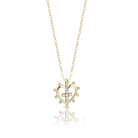 Collana in oro 18 kt con cuore sacro e croce di diamanti bianchi