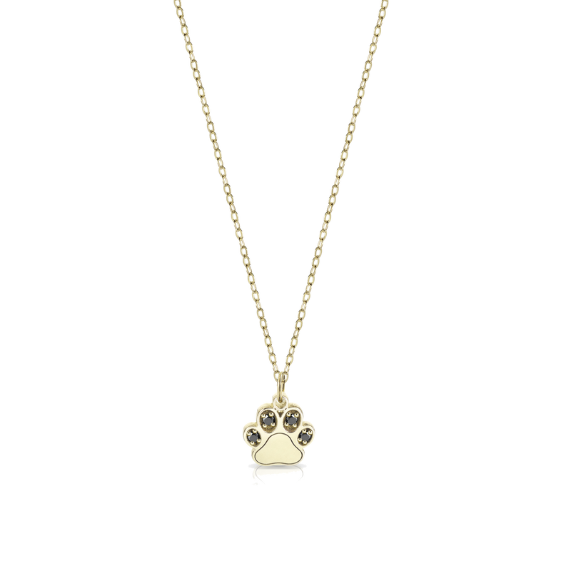 Gold necklace with paw-shaped pendant and black diamonds